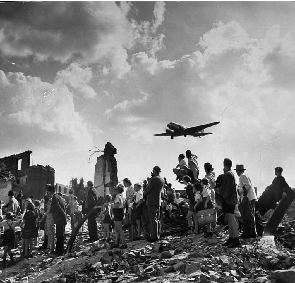 Photograph of cargo planes dropping relief supplies in the Berlin Airlift